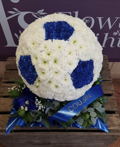 Football. - Football.  Based in white chrysanthemums and hexagons sprayed either in black or the colour of your choice. Finished with a floral spray in the colour of your choice.