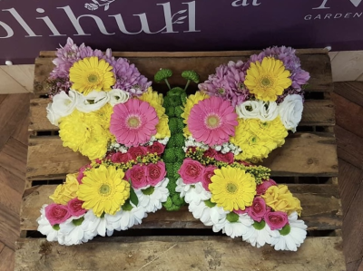 Butterfly. - Butterfly.  An oasis frame mainly based in chrysanthemums but finished using a variety of other flowers and colours of your choice to give it definition and effect.
