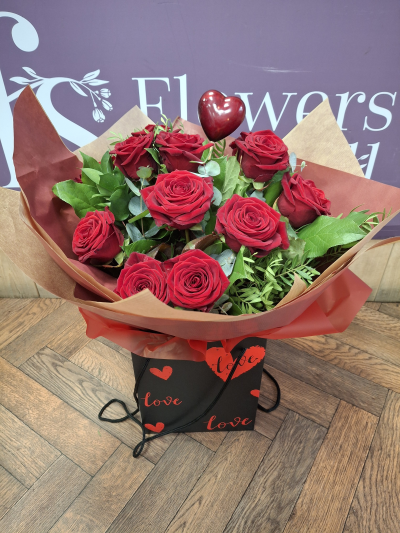 Secret Admirer - A dozen Red roses handtied by one of our florists and hand delivered to your someone special .