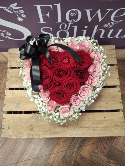 For my sweetheart - A heart shaped hatbox of flowers ,an arrangement in oasis of red and pink roses surrounded by a collar gypsophila .Hand delivered to your sweetheart .