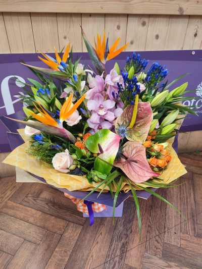 Totally tropical - A beautiful mix of tropical flowers ,something very different for that special person in your life .Delivered by hand .