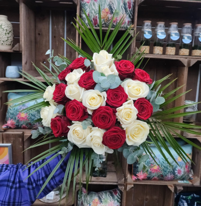 Ruby - 24 white and red roses handtied by one of our florists ,delivered by hand .