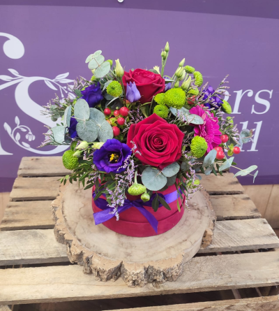 Jewel - A hatbox of flowers expertly arranged and delivered by hand .