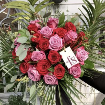Ruby - A beautiful handtied bouquet of 24 roses in lilac and red (12 or each ) created by one of our florists and hand delivered.